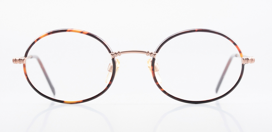Round CNL metal optical frame with tortoiseshell rim details